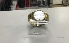 Часы  Casio золотого цвета