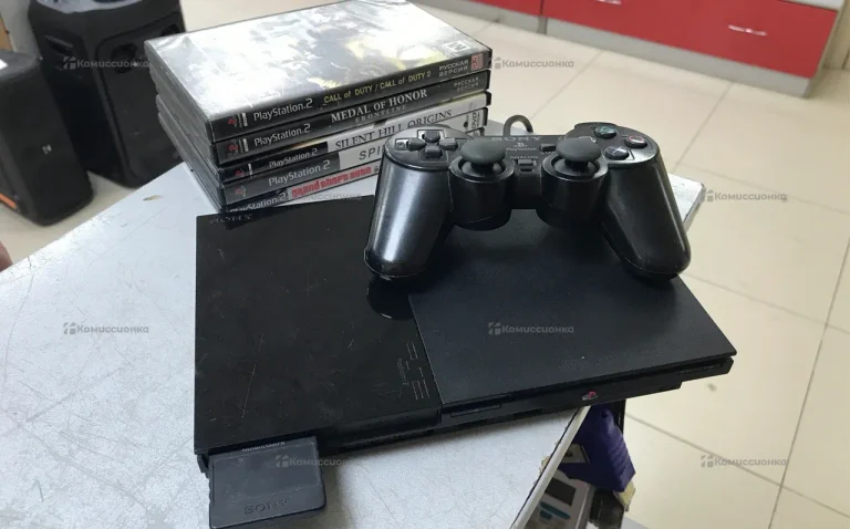 Приставка PlayStation 2 с дисками