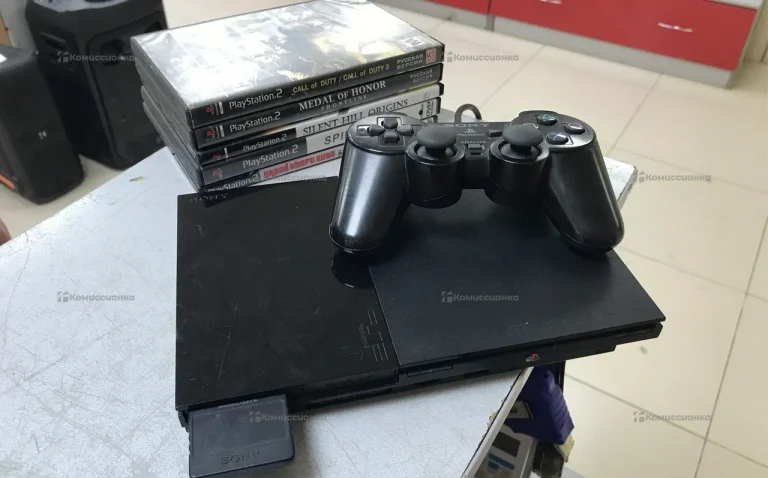 Приставка PlayStation 2 с дисками